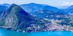 Lugano, największe miasto w kantonie Ticino. Na górze San Salvatore operator Swisscom utrzymuje obiekt nadawczy z którego nadawane są programy SRG SSR i operatora SMC (fot. Antonio Sessa/Unsplash)